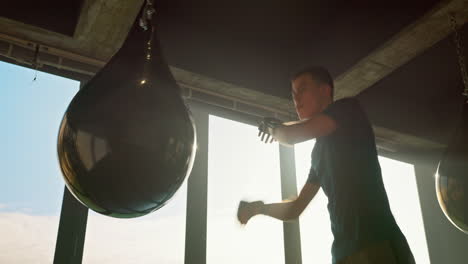 kick boxing, bag and man punching bag in the gym