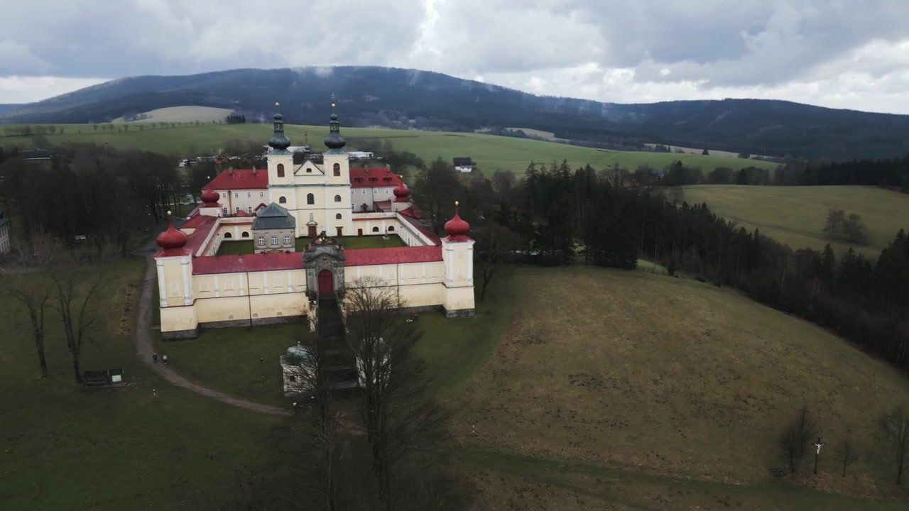 Stunning aerial view of the Hedeč pilgrimage site in the Czech Republic, showcasing the Mother of God monastery perched atop a mountain.