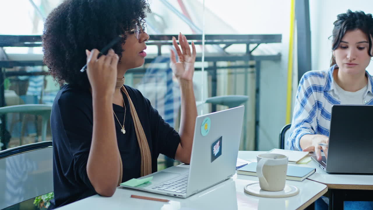 Gen Z Man Discussing Business Plans with Female Coworker