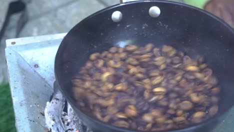 roasting ethiopian coffee during a coffee ceremony in addis ababa, ethiopia