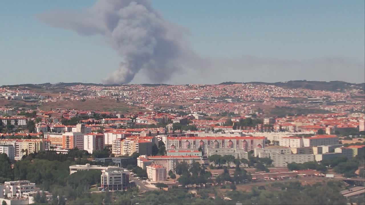 Zoom shot  of the Lisbon City Fire event from a distance, visible clouds of smoke
