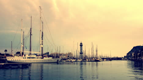 yacht port at sunset. timelapse of clouds on golden sky over yacht marina