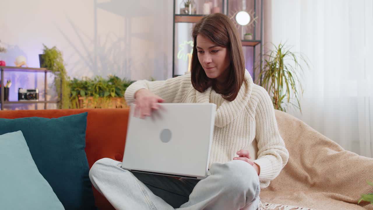 Pretty young woman use laptop surprised by bad news fortune loss fail lottery results at home