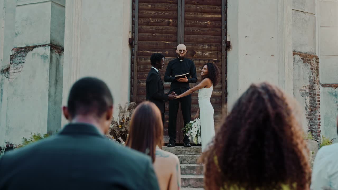 Wedding Ceremony with Diverse Couple and Priest