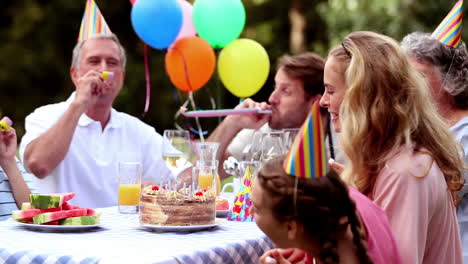 family celebrating the birthday of a girl