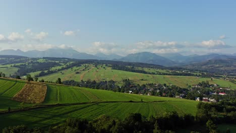 panoramic view of hilly fields and mountain landscape in poland on a sunny day in spring