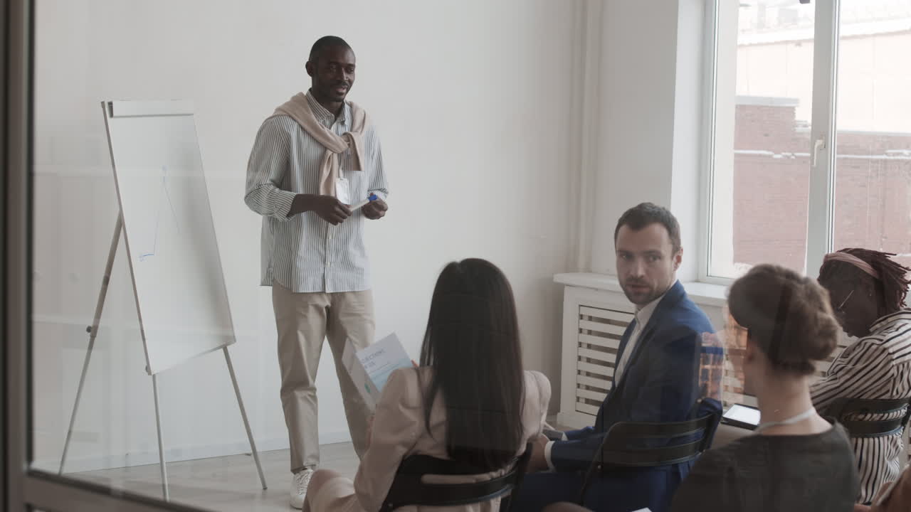 African Speaker Communicating with Audience