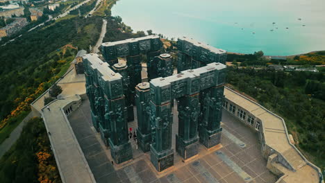 aerial view of the chronicle of georgia monument overlooking the tbilisi sea