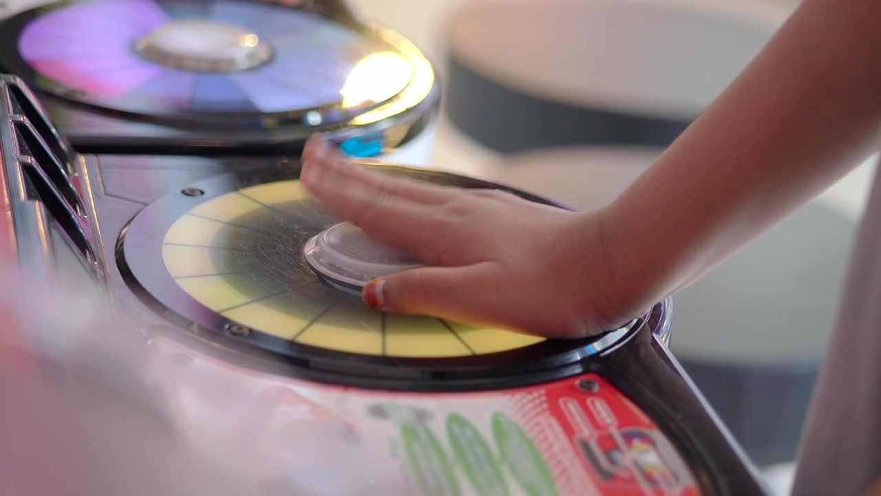 Child Playing Interactive Light Game at Arcade