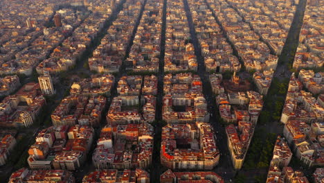 aerial view of square blocks in new quarter of barcelona at sunrise, spain