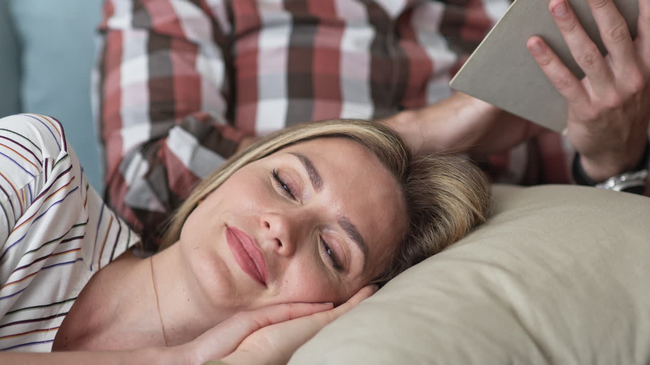 Couple relaxing and reading together