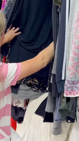 used clothes on hangers in a store a big pile of old useless clothes fashion used clothes on hangers in a store a big pile of old useless clothes fashion second hand