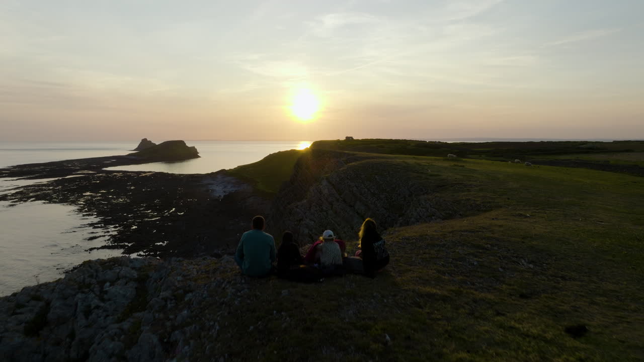 Sunset Viewpoint at Coastal Cliffs with People