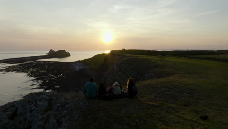 sunset viewpoint at coastal cliffs with people