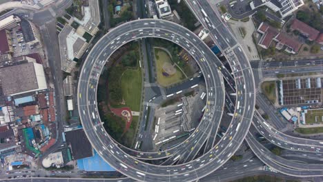 circular nanpu road junction. traffic circle. shanghai, china. aerial vertical top-down hyper lapse, time lapse. drone hovers and rotates. establishing shot