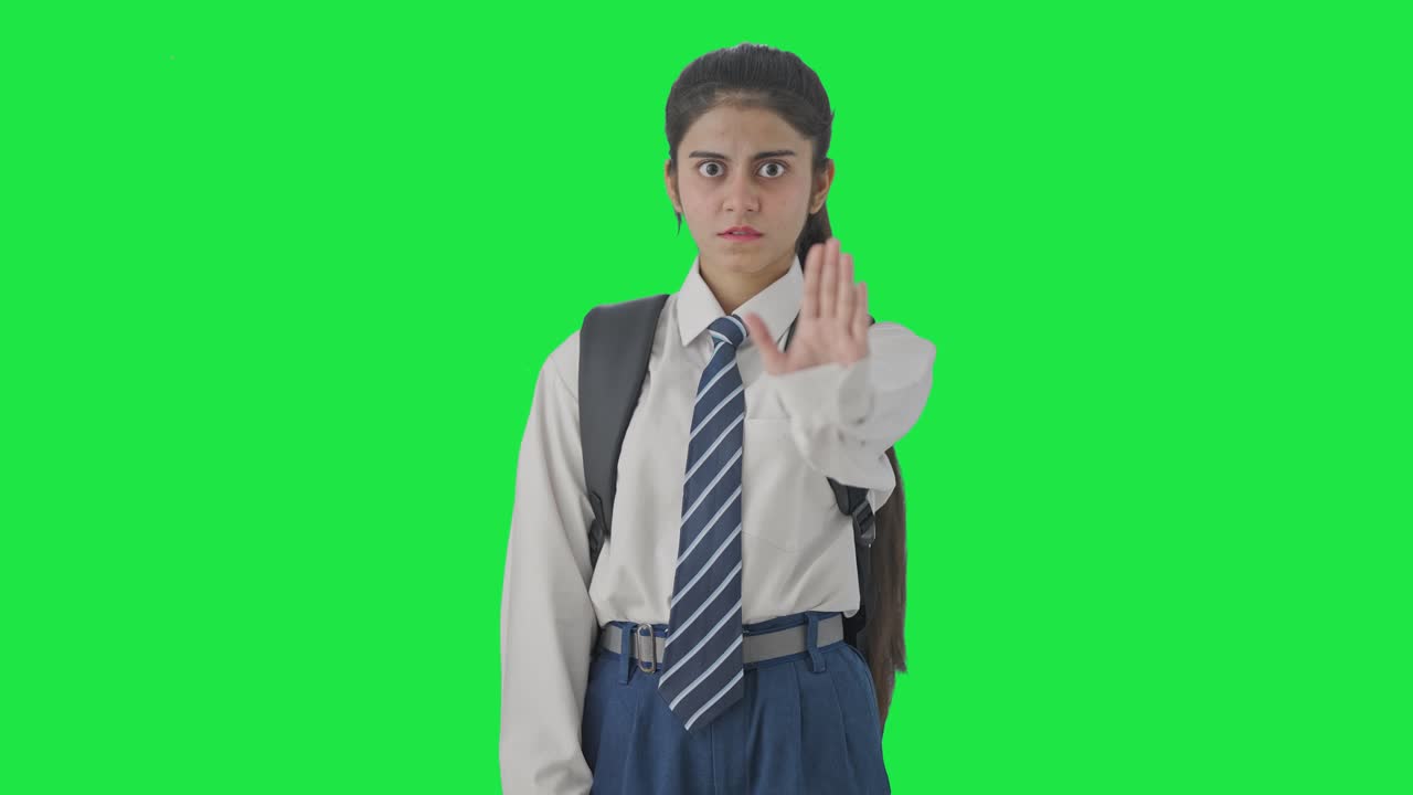Studentessa indiana arrabbiata che dice "No" e chiede di smettere, schermo verde