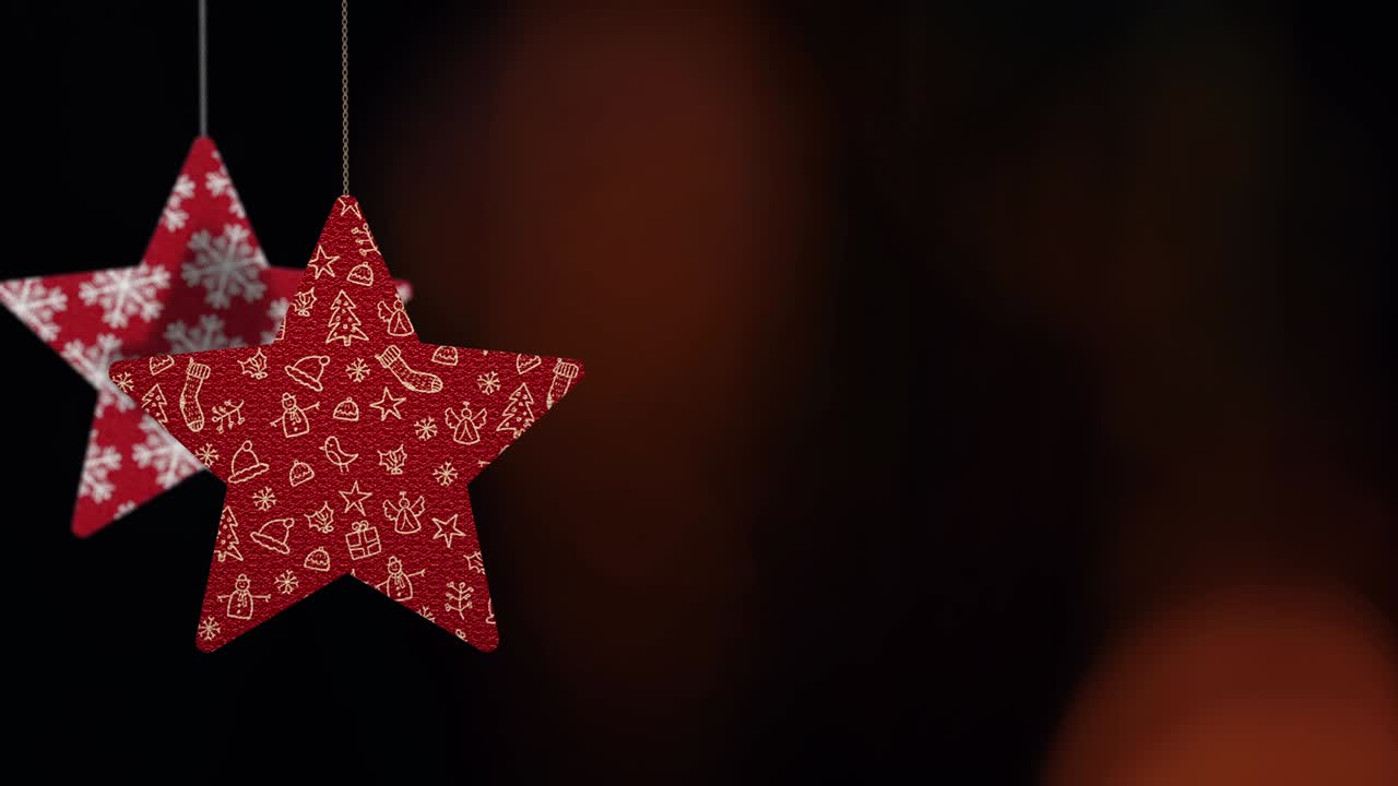 los adornos de las estrellas de navidad se mueven en el fondo de bokeh.