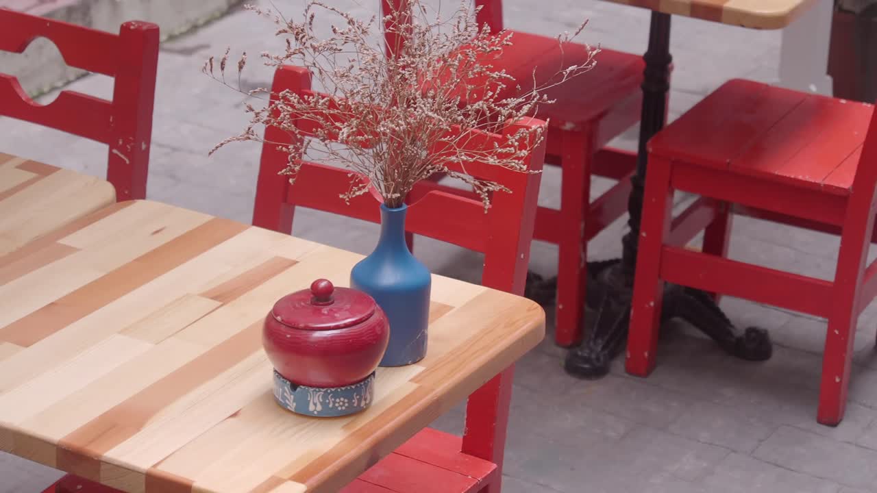 Red Chairs and Wooden Table Outdoor Cafe