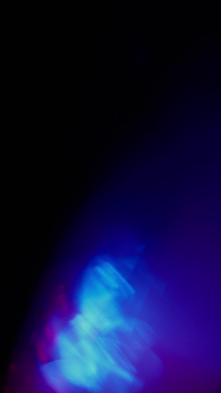 Abstract light leaks created by glass prism refraction. Vertical Format