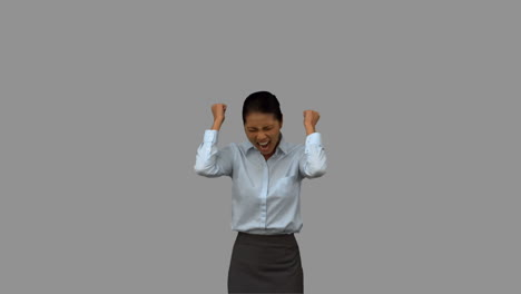 happy businesswoman gesturing on grey screen