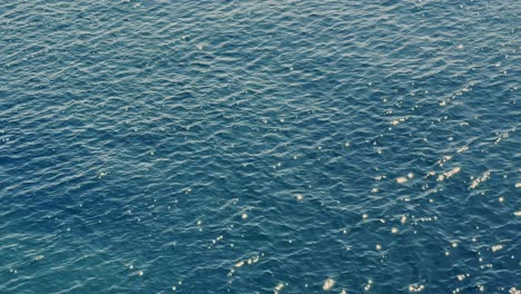 sun reflections sparkling on the sea in broad daylight