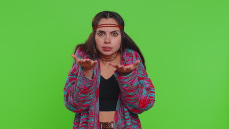 young woman keeping arm near ear for louder voice, asking to repeat, to hear information, deafness