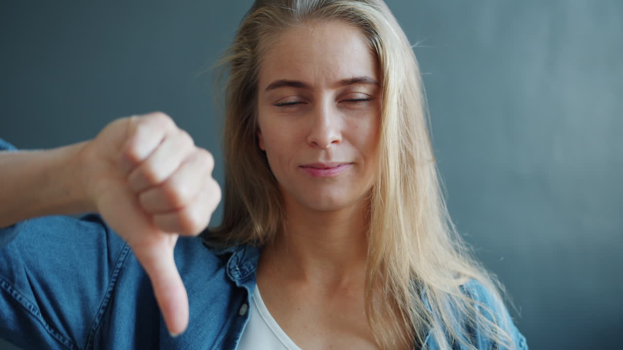 Woman giving a thumbs down