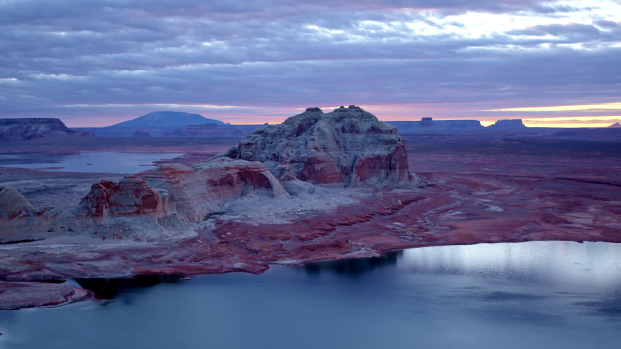 A stunning drone sequence captures the dramatic erosion patterns of Glen Canyon, framed by the vast desert landscape.