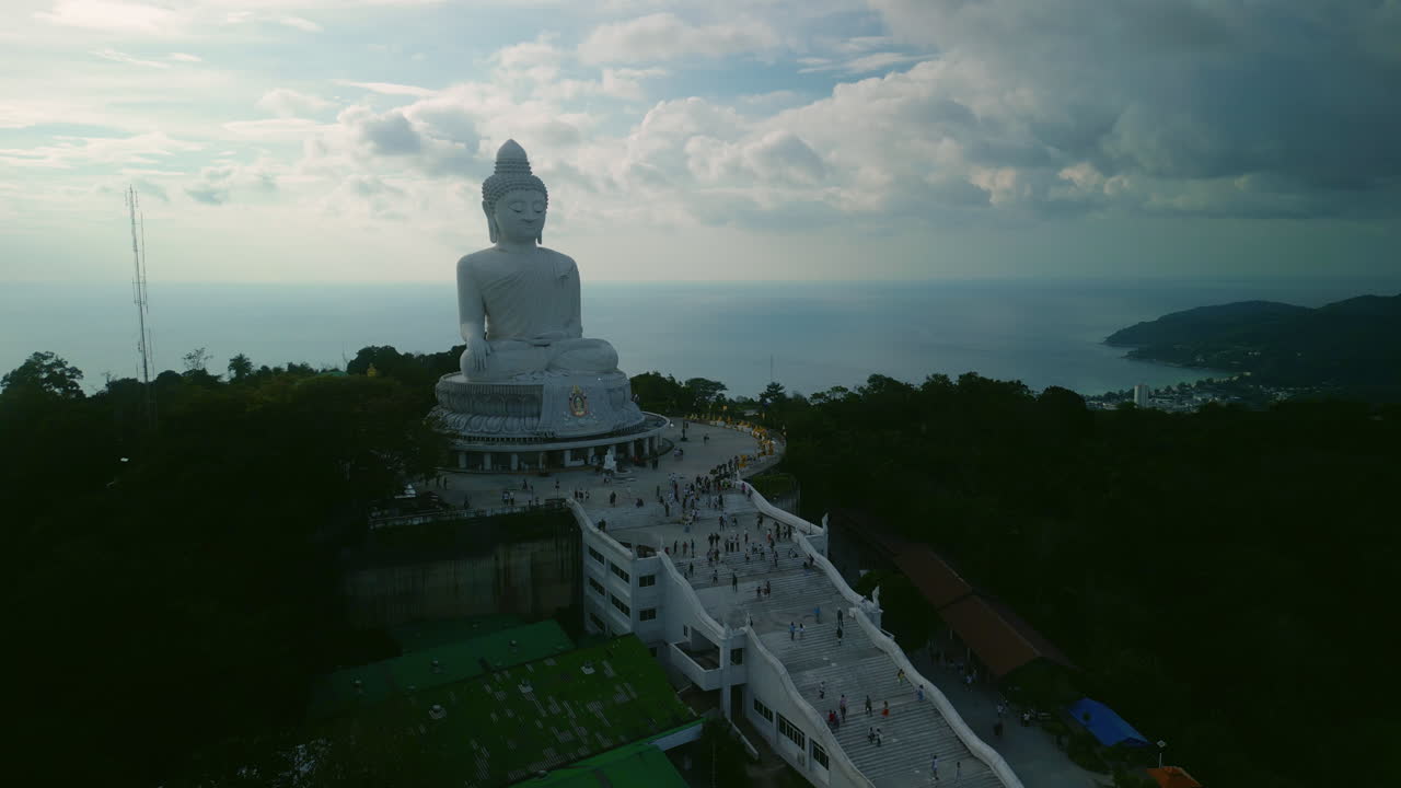 Giant Buddha Statue on a Mountaintop with Ocean View