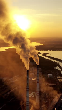 Industrial smoke from chimney. Industrial chimney of power plant pollution steam Vertical video