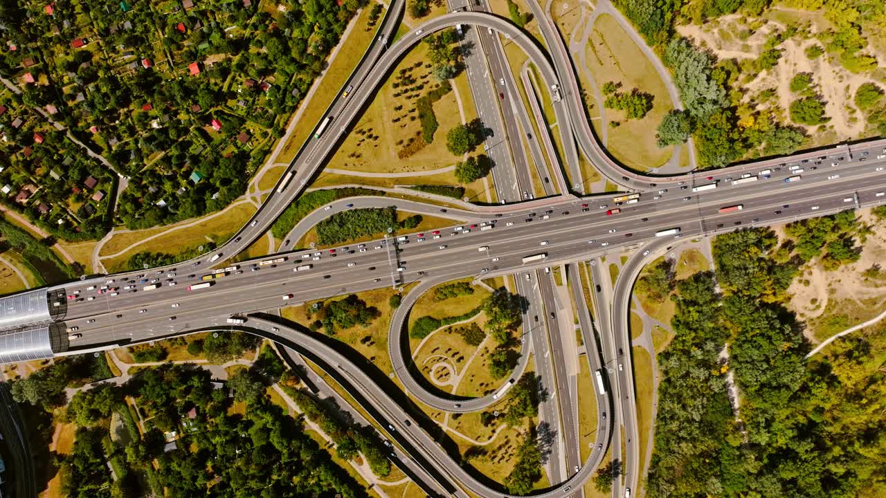 Aerial rotation, Warsaw road junction lines weaving through green city areas