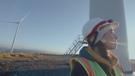 female engineer on wind power station in the morning