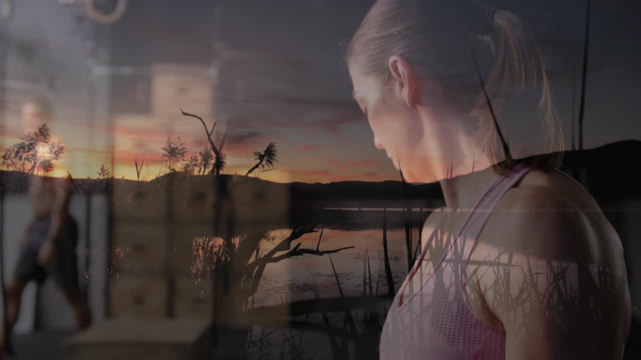 Reflecting over serene sunset lake, woman in athletic wear practicing animation