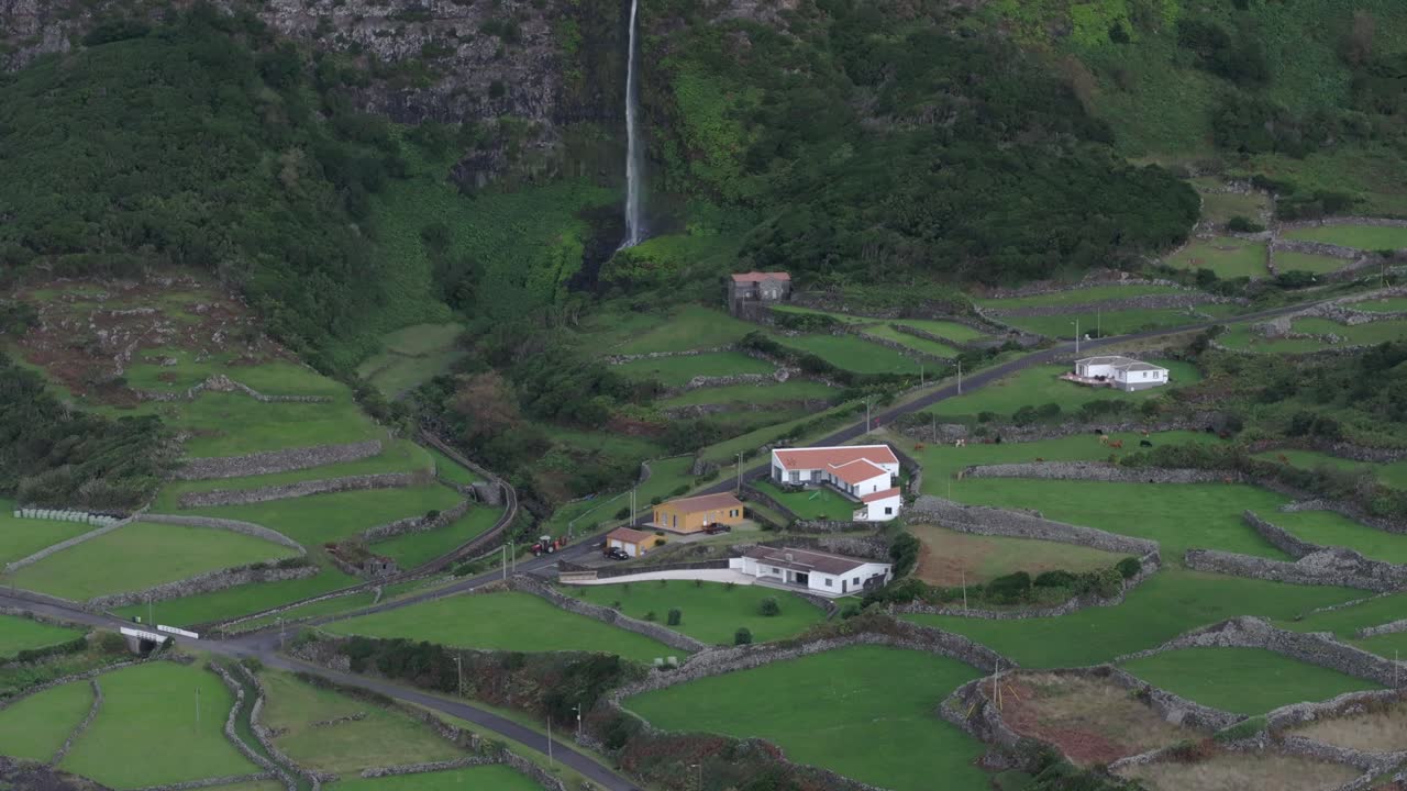 Wide view of cascata do poco do bacalhau waterfall at Faj&atilde; Grande - Drone shot