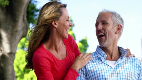 Portrait-of-mature-couple-is-looking-something-and-laughing
