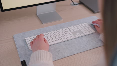 Woman-Working-On-Remote-Job-Typing-On-Wireless-Keyboard-Inside-The-Home-Office