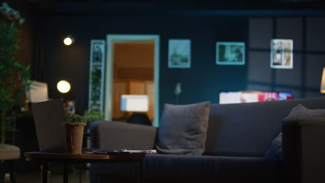 contemporary studio with modern decorations and neon lights creating a cozy casual living space with a smart tv and comfortable setup. empty apartment loft with trendy furniture.
