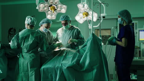 surgical team performing operation in operating room