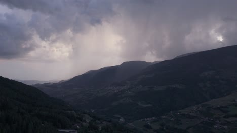 dramatic stormy weather over a mountain valley