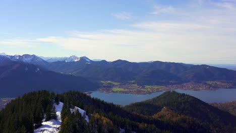 panning view over the snow capped mountains of the alps in autumn