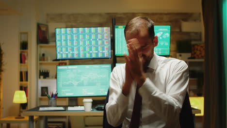 excited bearded man with a tie after checking the numbers