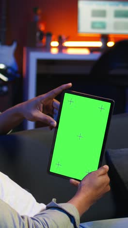 vertical video relaxed male tech user holding device with isolated mockup screen