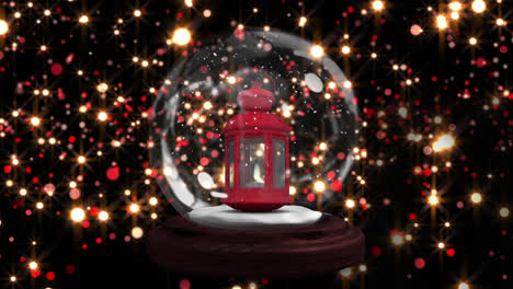 Animation-of-snow-globe-with-lantern-over-glowing-lights-on-black-background