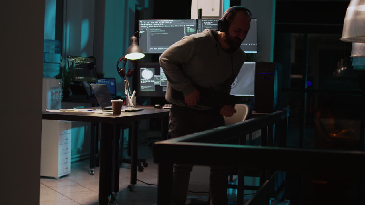 Man in office with computer and keyboard