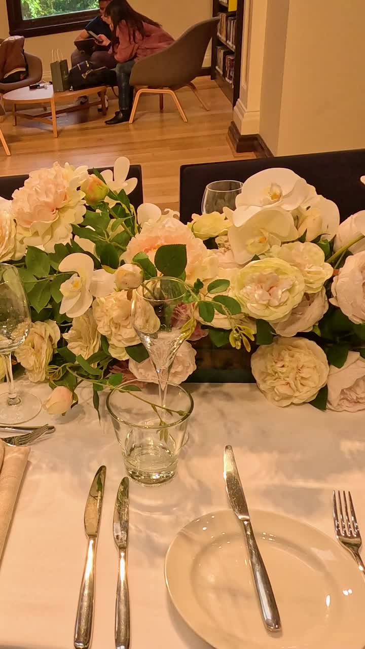 Beautifully arranged table with flowers and cutlery