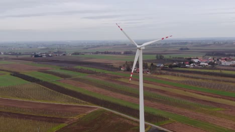 Wind-turbine-supply-village-in-Poland-with-renewable-energy,-clean-electric-power-concept