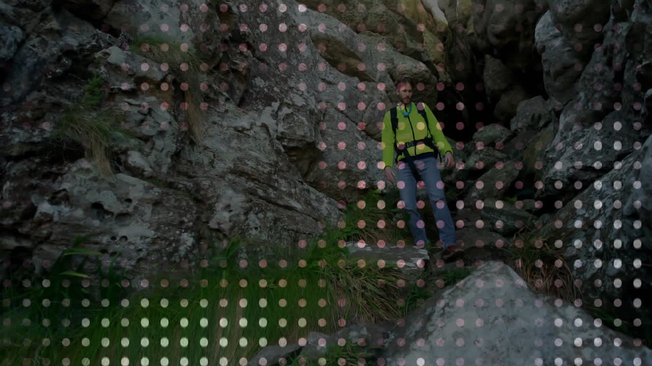 Man hiking down rocky pass, tracing floating route line and map icons for travel marketing