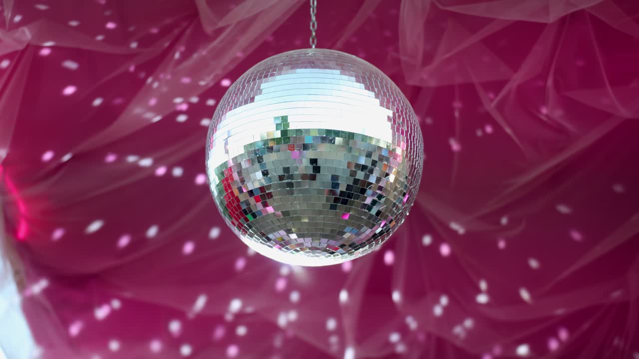 A disco ball reflecting light, creating a festive atmosphere