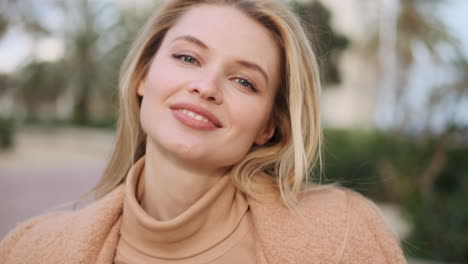 Young-woman-smiling-at-the-camera.