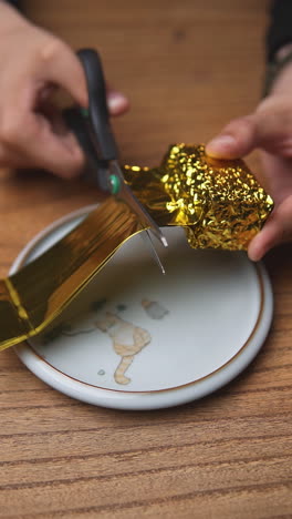 opening gold foil wrapped tea